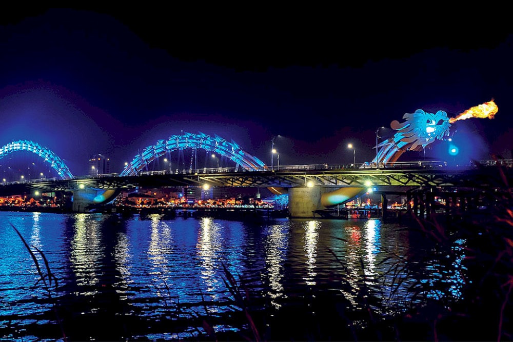 The Dragon Bridge dazzles at night with its ever-changing colors